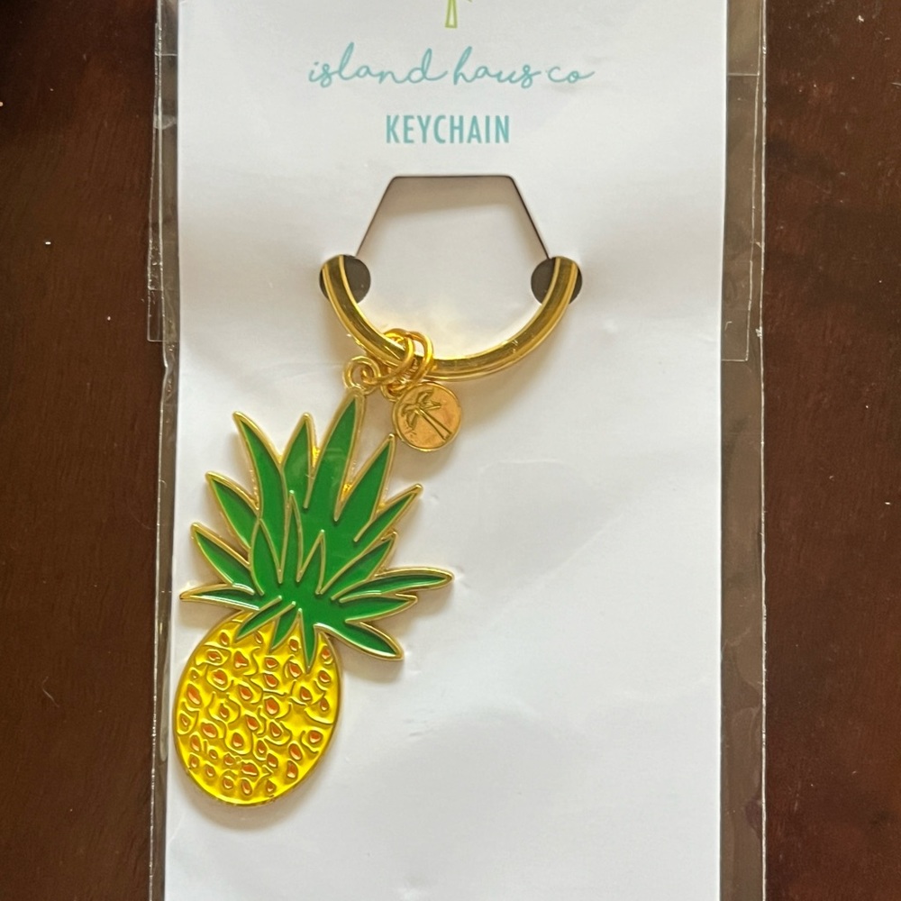 Beachly box winter 2023 items - nail file set, body scrub and keychain.